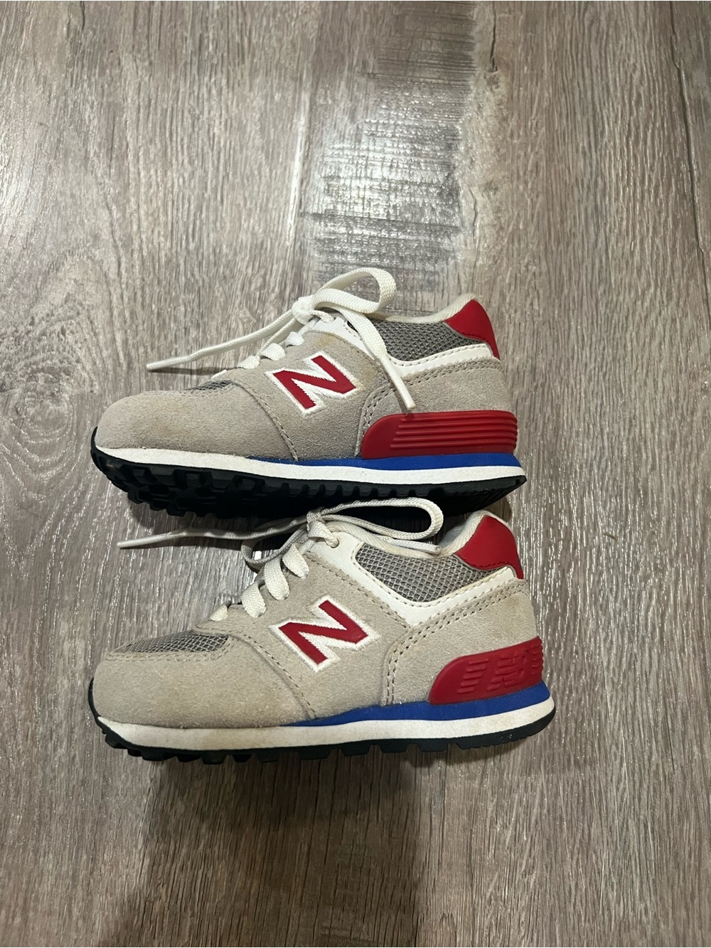 New Balance Kids Sneakers in Cream, Red, Blue, and Black